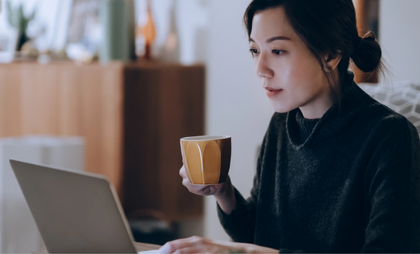 Woman at home on computer