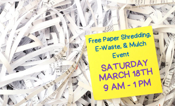 Shredded paper with yellow post-it note on top that says 