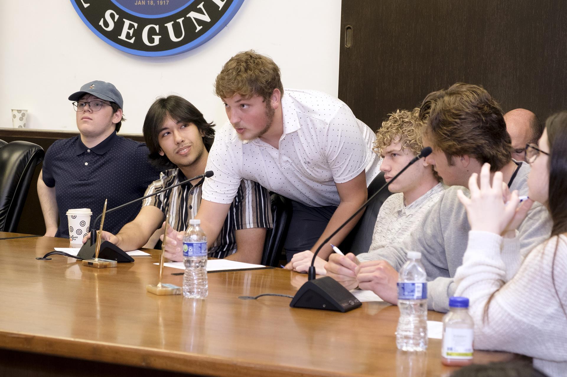 ESHS Students talking at dais during 2023 civic day mock city council meeting