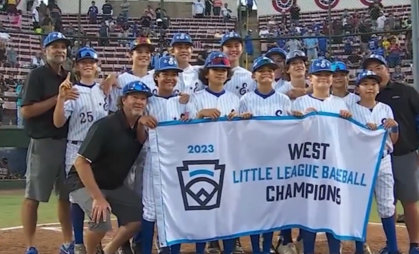 ESLL 12U All Star Team holding 2023 West Region Champion banner