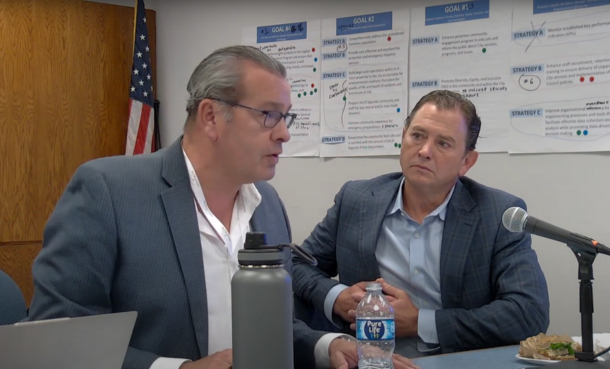 Mayor and City Manager at a desk talking