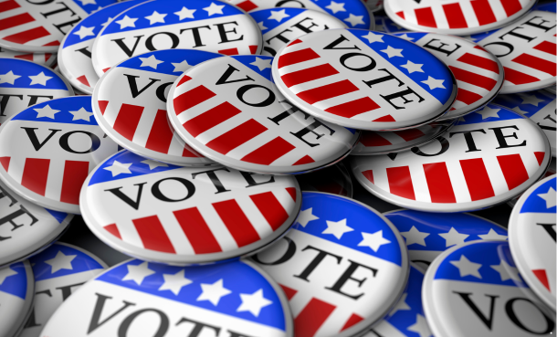 Buttons in red white and blue that say vote