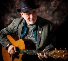 Photo of musician Gary Stockdale playing a guitar